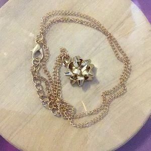 GOLD TONE BOW NECKLACE, never worn